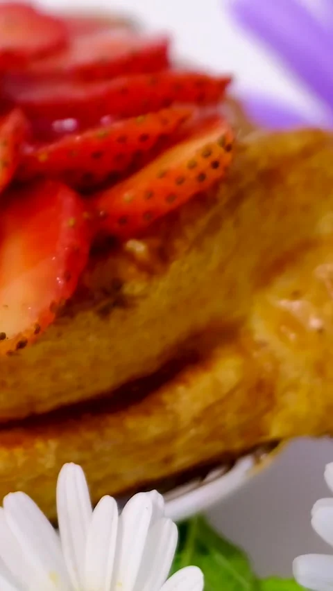 Flaky puff pastry filled with fresh strawberries and strawberry jam on white Stock Footage 346181526
