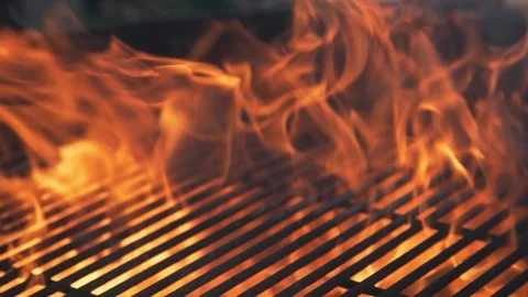 Flame and fire in the grill barbecue in the sunny summer day Stock Footage 143783388