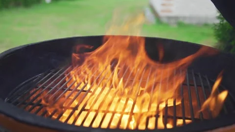 Flame and fire in the grill barbecue in the sunny summer day Stock Footage 143783418