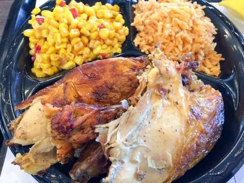 Flame broiled bbq chicken with rice and corn Stock Photos