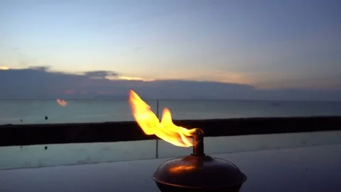 Flame Burning in Evening with Sea View Video stock 74073612