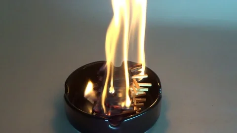 Flame of burning matches in an ashtray Stock Footage 101243013