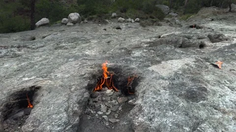 Flame of burning methane gas emerging from underground rock - Flammable Methane Stock Footage 339372249