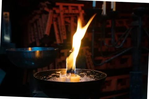 Flame burning at shrine Stock Photos