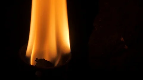 Flame of a burning torch.Near the stone wall. Stock Footage 97768495