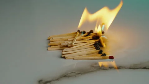 Flame burns out and someone blows it out with their breath Stock Footage