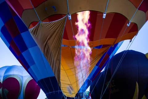 Flame bursts forth into hot-air balloon Stock Photos