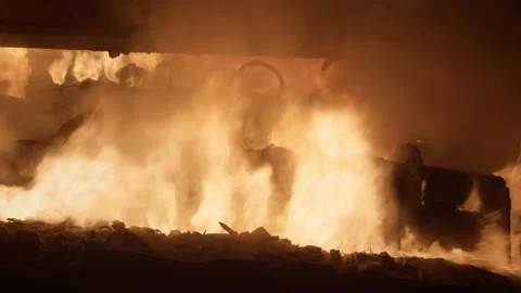 A flame bursts out of a furnace while melting steel in a metallurgical plant Stock Footage 172224598