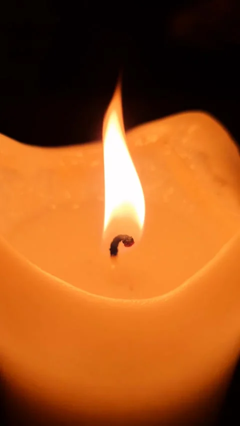 The flame of a candle light moving slowly in the wind. Stock Footage 257020512