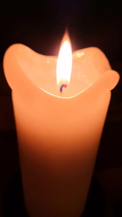 The flame of a candle light moving slowly in the wind. Stock Footage 257020530