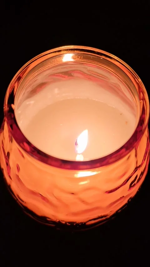 The flame of a candle light moving slowly in the wind. Stock Footage 257020546