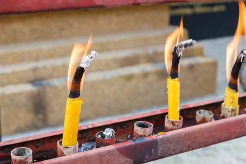 Flame of candle in temple Stock Photos