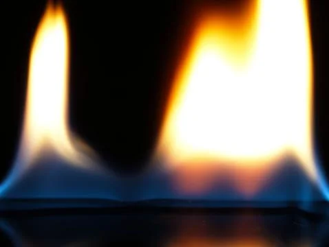 Flame close up on black background. Stock Photos