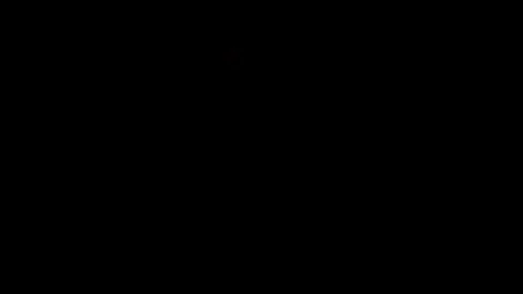 Flame concentrated in center of frame against black background Stock Footage 77134357
