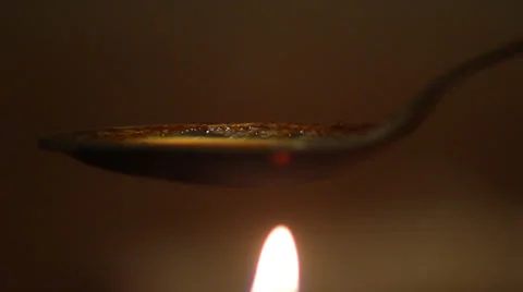 Flame cooking drugs Stock Footage 28617514