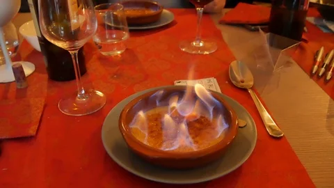 Flame on the creme brulee. Burn portion of creme brulee dessert on kitchen. D Stock Footage 123078528
