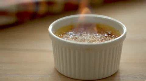 Flame on the creme brulee Stock Footage 49304599