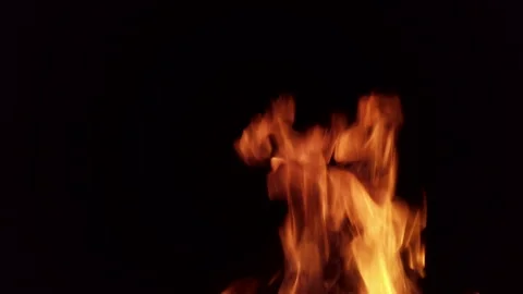 Flame dances in dark room offering simple visual display of fire in four frames Video stock 342369680