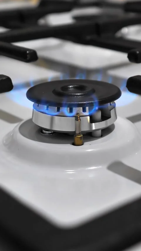 Flame during operation of the burner of the kitchen stove.  Stock Footage 306843497