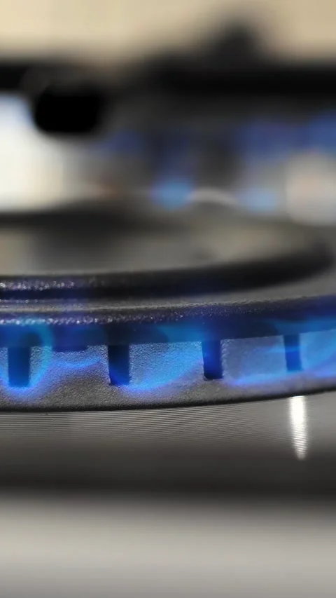 Flame during operation of the burner of the kitchen stove.  Stock Footage 306843506