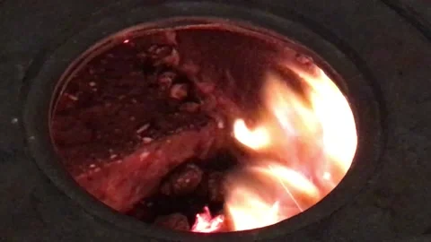 Flame of Fire Actively burning in the Round Circle of a Stove Hole 3 Stock Footage 168014010