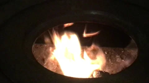 Flame of Fire Actively burning in the Round Circle of a Stove Hole Close Up Stock Footage 168014122