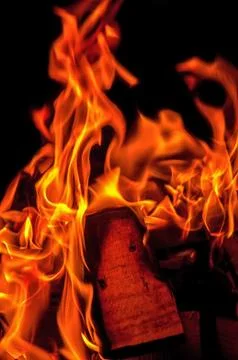 Flame fire on black background. Stock Photos