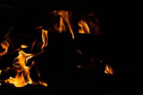 Flame of fire on a black background Stock Photos