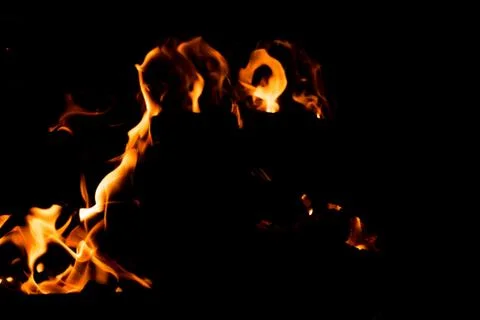 Flame of fire on a black background Stock Photos
