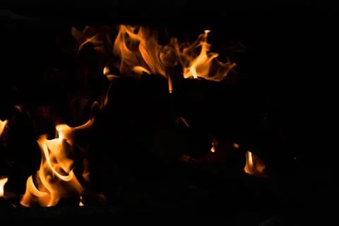 Flame of fire on a black background Stock Photos