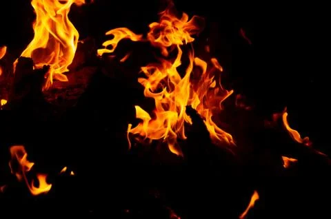Flame of fire on a black background Stock Photos
