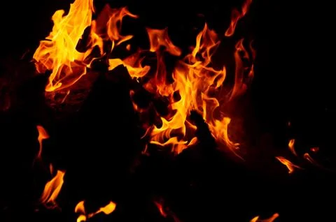 Flame of fire on a black background Stock Photos