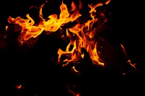 Flame of fire on a black background Stock Photos