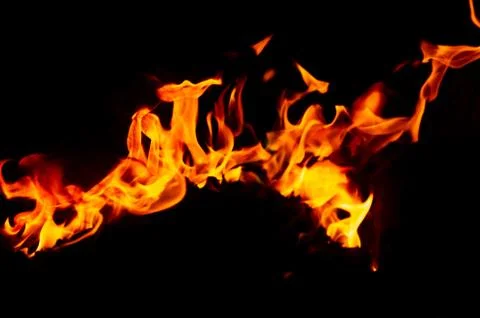 Flame of fire on a black background Stock Photos