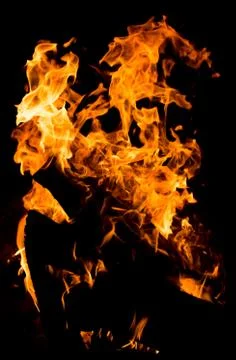 Flame of fire on a black background Stock Photos