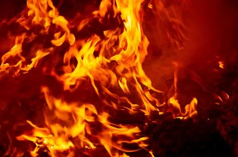 Flame of fire on a black background Stock Photos