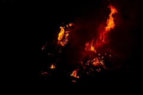Flame of fire on a black background Stock Photos