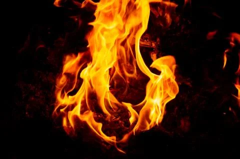Flame of fire on a black background Stock Photos