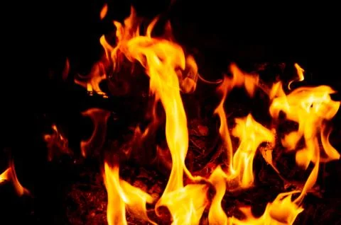Flame of fire on a black background Stock Photos