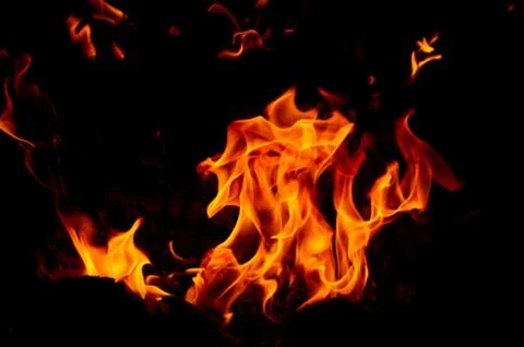 Flame of fire on a black background Stock Photos