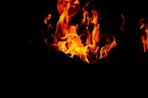 Flame of fire on a black background Stock Photos
