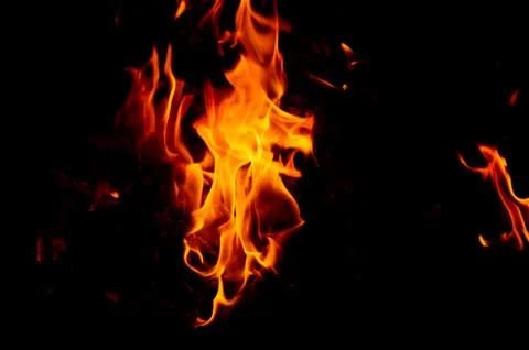 Flame of fire on a black background Stock Photos