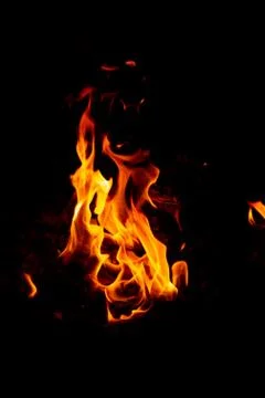 Flame of fire on a black background Stock Photos