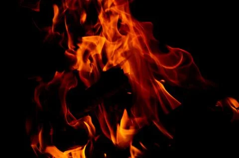 Flame of fire on a black background Stock Photos