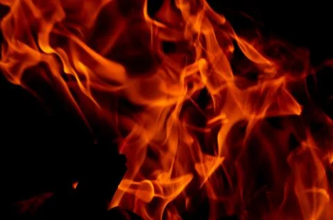 Flame of fire on a black background Stock Photos