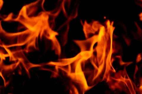 Flame of fire on a black background Stock Photos