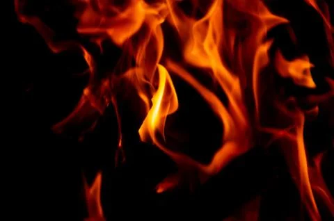 Flame of fire on a black background Stock Photos