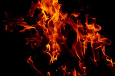 Flame of fire on a black background Stock Photos