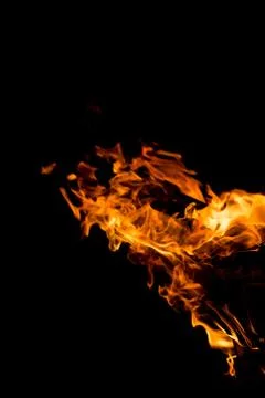 Flame of fire on a black background Stock Photos