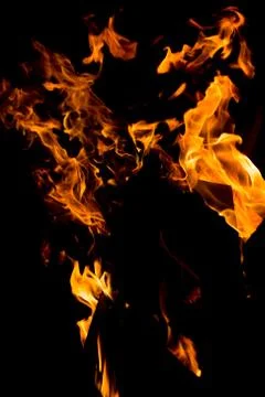 Flame of fire on a black background Stock Photos